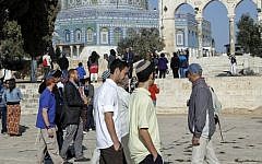 A group of Israeli Jews, accompanied by Yehudah Glick, chairman of the Fund for the Temple Mount and Temple Heritage organizations, seen in the Temple Mount courtyard near Al Aqsa Mosque, November 19 2013. (Photo credit: Sliman Khader/FLASH90)