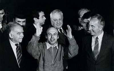 Former Soviet Prisoner of Zion Natan Sharansky with prime minister Shimon Peres, foreign minister Yitzhak Shamir, and Ariel Sharon, after his release from prison in the Soviet Union, on arrival in Israel on February 11, 1986. (Photo credit: Moshe Shai/FLASH90)