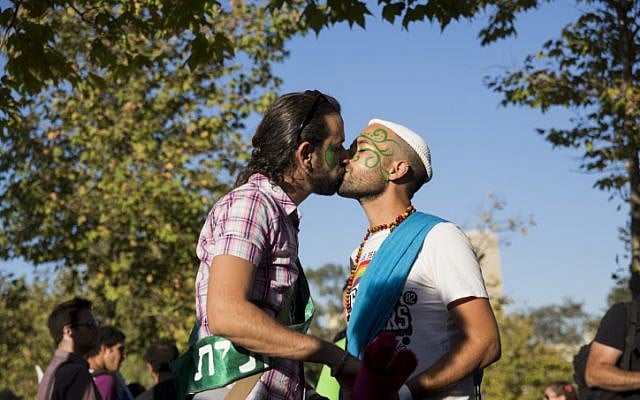 A couple kisses at the annual Gay Pride Parade in Jerusalem on August 1, 2013. (photo credit: Sarah Schuman/ Flash90) A couple kisses at the annual Gay Pride Parade in Jerusalem on August 1, 2013. (photo credit: Sarah Schuman/ Flash90)