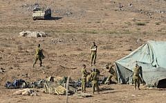 Soldiers setting up an Israeli field hospital in the Golan Heights (photo credit: Gili Yaari/Flash90)