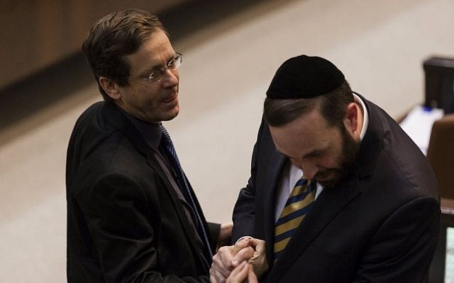 Newly-elected Labor Party leader Isaac Herzog (left) speaks to ultra-Orthodox Shas MK Ariel Atias during a Knesset plenum session, November 2013. (photo credit: Flash90) Newly-elected Labor Party leader Isaac Herzog (left) speaks to ultra-Orthodox Shas MK Ariel Atias during a Knesset plenum session, November 2013. (photo credit: Flash90)