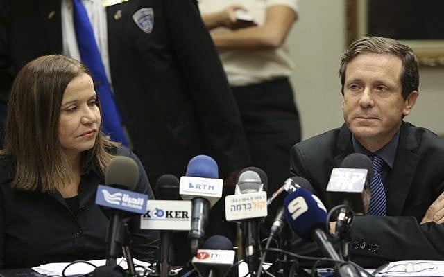 Labor Party leader Isaac Herzog with his predecessor Shelly Yachimovich, in the Knesset on November 25, 2013. (Photo credit: Yonatan Sindel/Flash90)