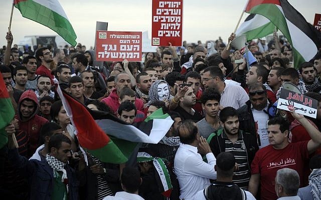 Police and protesters clash at a rally where around 1,200 demonstrators gathered in the southern Israeli town of Hura during a protest against the government's plan to resettle some 30,000 Bedouin residents of the Negev desert Saturday. (photo credit: David Buimovitch/Flash90) Police and protesters clash at a rally where around 1,200 demonstrators gathered in the southern Israeli town of Hura during a protest against the government's plan to resettle some 30,000 Bedouin residents of the Negev desert Saturday. (photo credit: David Buimovitch/Flash90)