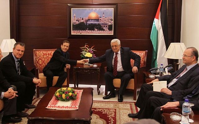 Newly elected Labor leader Isaac Herzog meets with Palestinian Authority President Mahmoud Abbas in Ramallah. December 1, 2013. (Photo credit: Issam Rimawi/FLASH90)