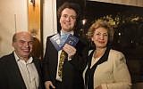 Evgeny Kissin shows off his new Israeli identification card and passport (photo credit: Yontatan Sindel/Flash 90)