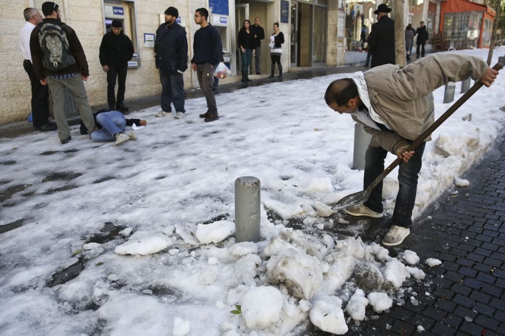Notice the garden shovel used in a pinch for clearing snow (photo credit: Nati Shochat/Flash 90)