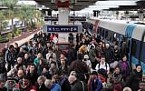 People who were stranded in Jerusalem during the major snowstorm that hit the capital arrive at the Tel Aviv Merkaz train station on December 14, 2013. (Gideon Markowicz/Flash90)