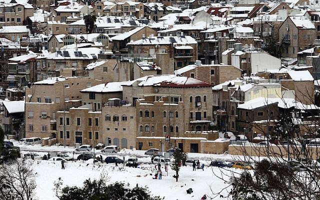 The snow-covered rooftops of Jerusalem's Nachlaot neighborhood (photo credit: Nati Shohat/Flash90)