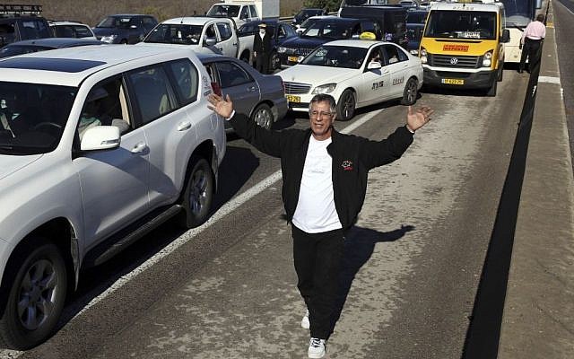 Cars stuck in a traffic jam on Route 1, on Sunday morning, December 15, 2013. The Jerusalem-Tel Aviv highway was blocked due to temperatures dropping below zero causing icy roads after three days of a heavy snow storm in the capital region. (Photo credit: Nati Shohat/Flash 90)