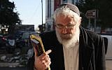 Rabbi Mordechai Elon arrives at the Jerusalem Magistrate's Court to hear his sentence, December 18, 2013. (photo credit: Meital Cohen/Flash90)