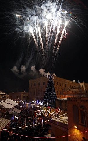 Fireworks over the Christmas tree in Jerusalem's Old City (photo credit: Sliman Khader/Flash90) Fireworks over the Christmas tree in Jerusalem's Old City (photo credit: Sliman Khader/Flash90)