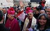 Latin Patriarch of Jerusalem Fouad Twal, center, arrives at the Church of the Nativity, in the West Bank city of Bethlehem, December 24, 2013 (photo credit: Issam RImawi/Flash90)