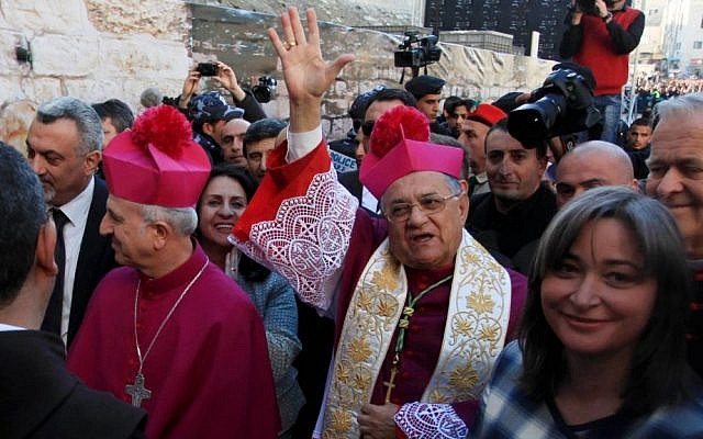 Latin Patriarch of Jerusalem Fouad Twal, center, arrives at the Church of the Nativity, in the West Bank city of Bethlehem, December 24, 2013 (photo credit: Issam RImawi/Flash90) Latin Patriarch of Jerusalem Fouad Twal, center, arrives at the Church of the Nativity, in the West Bank city of Bethlehem, December 24, 2013 (photo credit: Issam RImawi/Flash90)