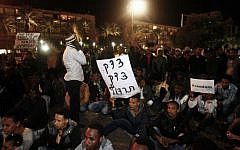 African asylum seekers participate in a protest march in Tel Aviv, Israel, Saturday, December 28, 2013 (photo credit: Roni Schutzer/Flash90)