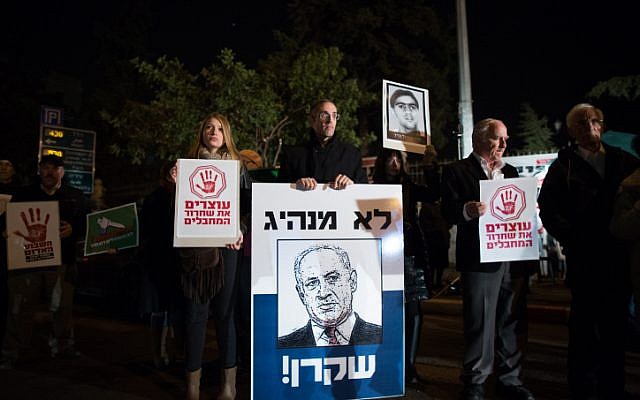 Demonstrators, some of them relatives of Israelis killed by Palestinians, protest against the upcoming Palestinian prisoner release near the Prime Minister's residence in Jerusalem on December 28, 2013. The placard showing a drawing of Benjamin Netanyahu says in Hebrew: "Not a leader, [a] liar."  (Photo credit: Yonatan Sindel/Flash90)