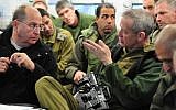 Defense Minister Moshe Ya'alon (L) and IDF Chief of Staff Benny Gantz seen during a drill with the Tse'elim Division on Tuesday, December 31, 2013 (photo credit: Ministry of Defense/FLASH90)