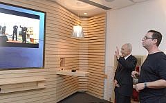 President Shimon Peres 'makes his move' in a demonstration of the Microsoft Xbox One system by Dr. Eyal Ofek (Photo credit: Courtesy)