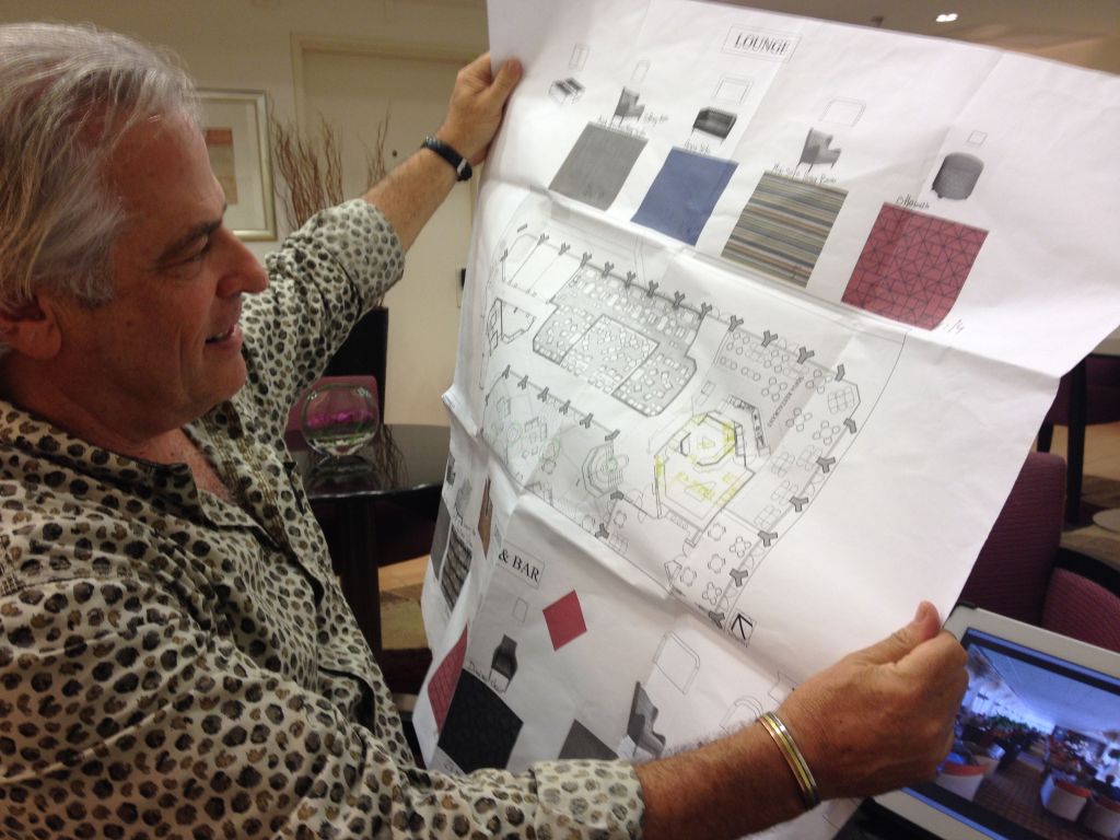 Michael Schwartz shows the hotel's renovation plans, which includes redoing the inner lobby with more intimate seating and work areas (photo credit: Jessica Steinberg/Times of Israel)