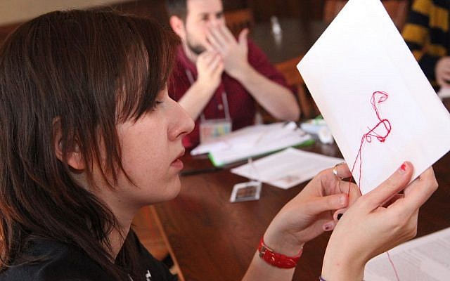 Poet Gala Mukomolova at a session called 'Drawing Meaning from the Red Thread'. (photo credit: Shulamit Siedler-Feller) Poet Gala Mukomolova at a session called 'Drawing Meaning from the Red Thread.' (photo credit: Shulamit Siedler-Feller)