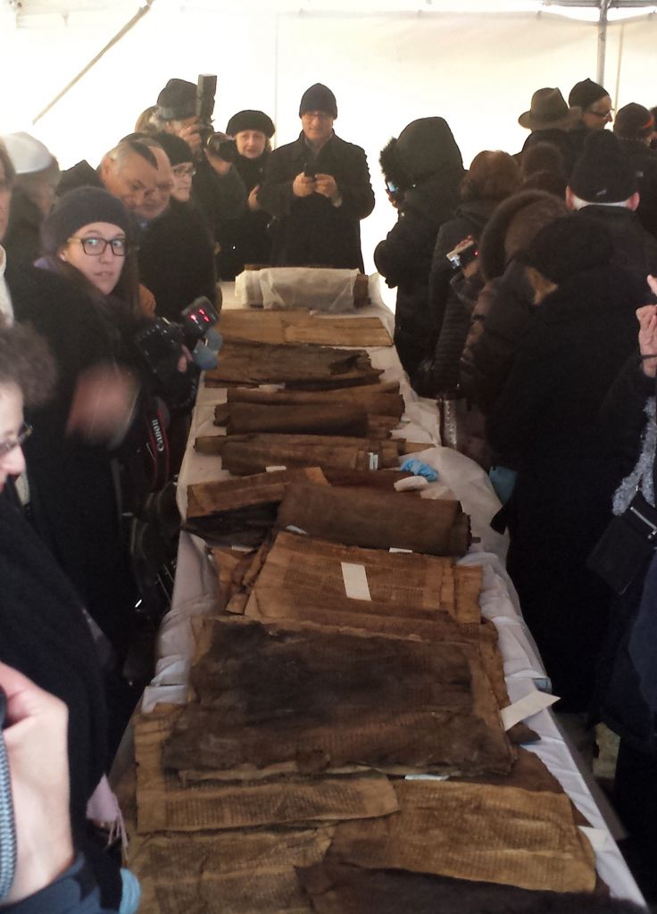 This photo shows damaged Iraqi Torah scroll fragments on display before they were buried at New Montefiore Cemetery in West Babylon, New York, on Sunday (photo credit: AP) This photo shows damaged Iraqi Torah scroll fragments on display before they were buried at New Montefiore Cemetery in West Babylon, New York, on Sunday (photo credit: AP)