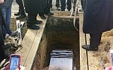 This photo of a special service at New Montefiore Cemetery in West Babylon, New York, shows damaged Torah scroll fragments being buried in a religious ceremony on Sunday (photo credit: AP)