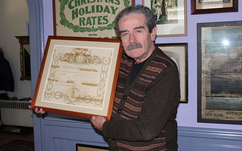 Major League Baseball’s official historian, John Thorn, pictured holding a royal decree knighting his great-grandfather, says the past enhances the present in sports as well as family matters. (photo credit: Hillel Kuttler/JTA) Major League Baseball’s official historian, John Thorn, pictured holding a royal decree knighting his great-grandfather, says the past enhances the present in sports as well as family matters. (photo credit: Hillel Kuttler/JTA)