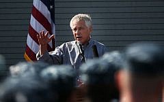Chuck Hagel speaks to military service members aboard the USS Ponce in Manama, Bahrain, Friday. (photo credit: AP/Mark Wilson, Pool)