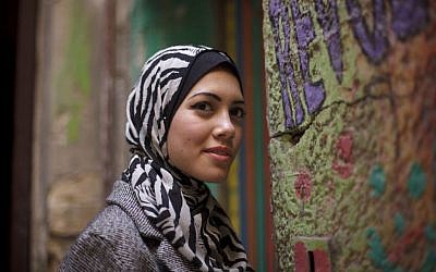 Egyptian rapper Myam Mahmoud poses for a portrait in downtown Cairo. Mahmoud, an 18-year-old Egyptian, rapped her way to the semi-finals of the Middle East’s hit TV show Arabs Got Talent. While she didn’t win the program, Mahmoud did succeed in shining a spotlight on the social ills that plague Egypt today. (AP Photo/Maya Alleruzzo)
