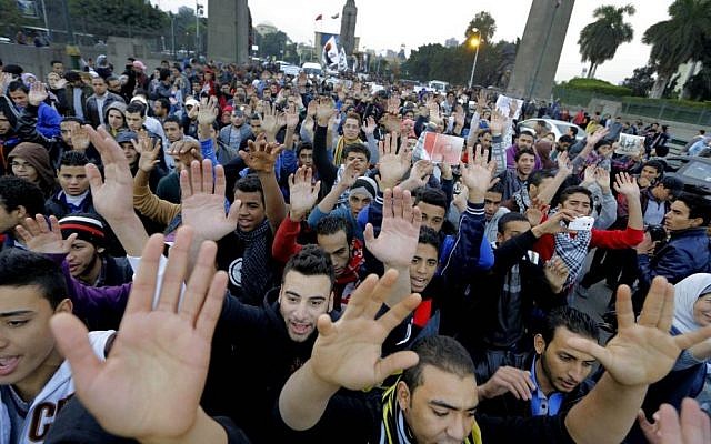 Egyptian protesters chant anti-police and military slogans as they march towards the Egyptian Cabinet in Cairo, Egypt, on Monday (photo credit: AP/Amr Nabil) Egyptian protesters chant anti-police and military slogans as they march towards the Egyptian Cabinet in Cairo, Egypt, on Monday (photo credit: AP/Amr Nabil)