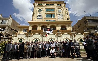 In this April 30, 2011 file photo, Egyptian Muslim brotherhood Shura council members gather to be photographed outside the new Muslim Brotherhood headquarters in Cairo, Egypt. (photo credit: AP/Khalil Hamra)