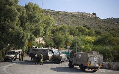 Israeli soldiers guard the area near the border between northern Israel and Lebanon, December 16, 2013. (photo credit: AP/Ariel Schalit)