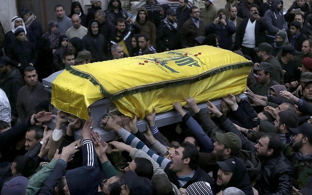 Lebanese mourners carry the coffin of a senior commander of the Lebanese group Hezbollah (photo credit: AP/Hussein Malla)