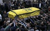Lebanese mourners carry the coffin of a senior commander of the Lebanese group Hezbollah (photo credit: AP/Hussein Malla)