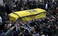 Lebanese mourners carry the coffin of a senior commander of the Lebanese group Hezbollah (photo credit: AP/Hussein Malla)