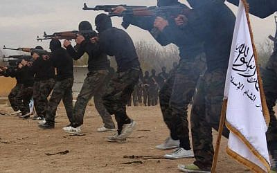 In this undated picture released on Friday, November 29, 2013, and posted on the Facebook page of a militant group, members of Ahrar al-Sham brigade, one of the Syrian rebels groups, exercise in a training camp at unknown place in Syria. (AP Photo)