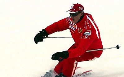 In this Thursday, Jan. 12, 2006 file photo provided by the Ferrari press office, Formula One driver Michael Schumacher of Germany speeds down a course in the Madonna di Campiglio ski resort, in the Italian Alps . (AP/Ferrari, File)