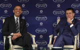 President Barack Obama, speaking (with Haim Saban) at the Saban Forum in Washington on December 7, laughs when asked if he and Prime Minister Benjamin Netanyahu would analyze the Geneva deal with Iran differently. (photo credit: Saban Forum screen shot)