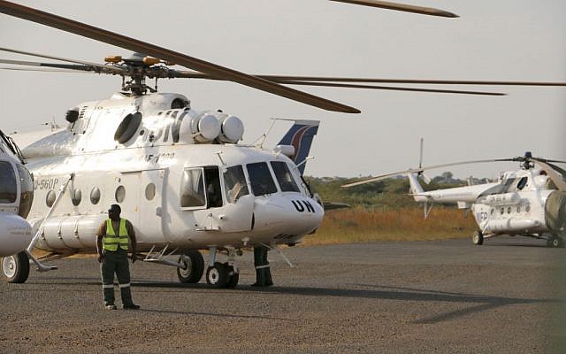 A UN helicopter transporting wounded civilians from Bor, the capital of Jonglei state, arrives at the airport in Juba, South Sudan, Sunday, Dec. 22, 2013. (photo credit: AP/UNMISS)