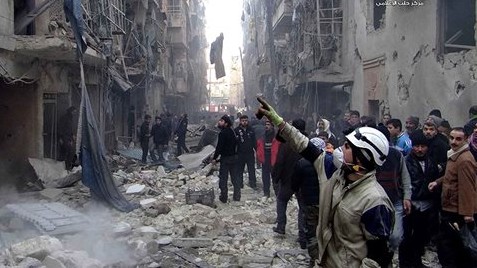 Syrians inspect damages buildings following a Syrian government airstrike in Aleppo, Syria, Sunday, Dec. 15, 2013 (photo credit: AP/Aleppo Media Center, AMC) Syrians inspect damages buildings following a Syrian government airstrike in Aleppo, Syria, Sunday, Dec. 15, 2013 (photo credit: AP/Aleppo Media Center, AMC)