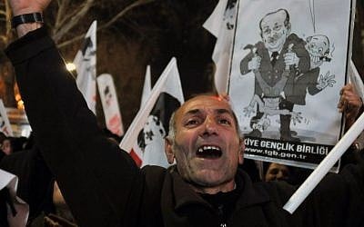 A protester shouts " catch the thief!.."as several hundred people call on the government to resign during a protest in Ankara, Turkey, late Friday, Dec. 27, 2013. (Photo credit: AP)