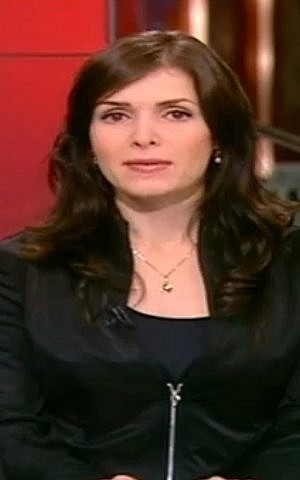 News presenter Tali Metz rocks an all-black outfit that TV host Yoav Limor said made her 'looks like she walked out of an S&M club' (screen capture: Channel 2)