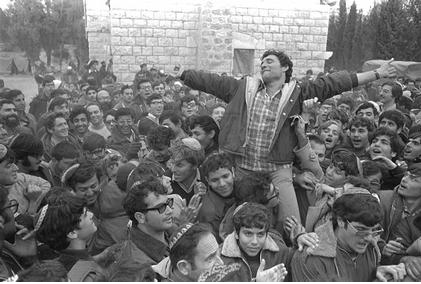 Gush Emunim leader Hanan Porat is in his dubon as he is carried on the shoulders of his followers, as they celebrate the decision to allow the settlers to stay in Samaria (photo credit: Moshe Milner/GPO) Gush Emunim leader Hanan Porat is in his dubon as he is carried on the shoulders of his followers, as they celebrate the decision to allow the settlers to stay in Samaria (photo credit: Moshe Milner/GPO)