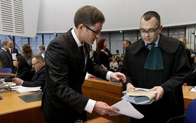Michael Pietrzak, right, one of the lawyers of Abd al-Rahim al-Nashiri and Abu Zubaydah, is helped by an assistant as he arrives at the forth section of the European Court of Human Rights in Strasbourg, eastern France, Tuesday, Dec. 3, 2013 (photo credit: AP Photo/Christian Lutz) Michael Pietrzak, right, one of the lawyers of Abd al-Rahim al-Nashiri and Abu Zubaydah, is helped by an assistant as he arrives at the forth section of the European Court of Human Rights in Strasbourg, eastern France, Tuesday, Dec. 3, 2013 (photo credit: AP Photo/Christian Lutz)