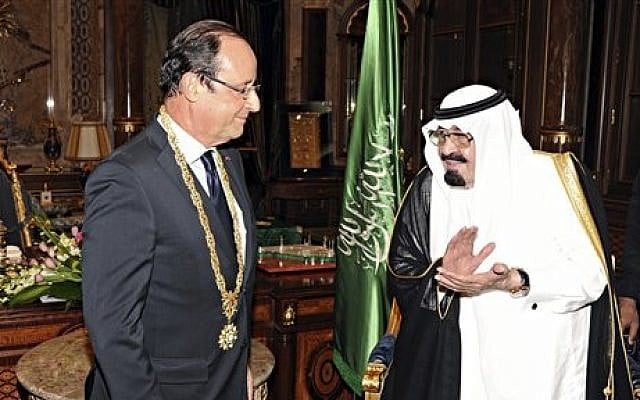 King Abdullah of Saudi Arabia, right, applauds French President Francois Hollande, left, after presenting him with the Order of Merit in Jiddah, Saudi Arabia, Sunday, Nov. 4, 2012 (photo credit: AP/SPA, File) King Abdullah of Saudi Arabia, right, applauds French President Francois Hollande, left, after presenting him with the Order of Merit in Jiddah, Saudi Arabia, Sunday, Nov. 4, 2012 (photo credit: AP/SPA, File)