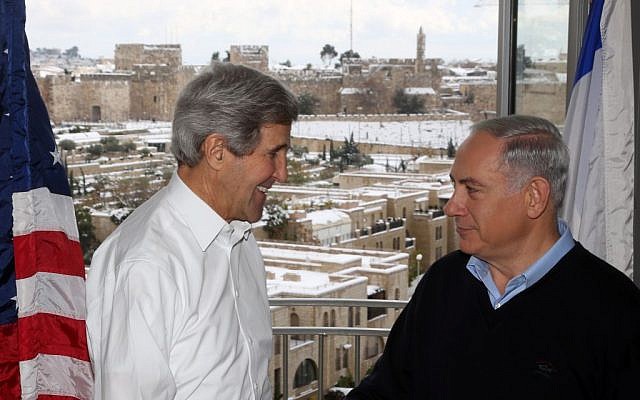 Secretary of State John Kerry meets with Prime Minister Benjamin Netanyahu in a Jerusalem hotel on December 13, 2013. The suite's balcony overlooks the Old City walls of Jerusalem and the Jaffa Gate area amid a major snow storm (Photo credit: Marc Israel Sellem/POOL/Flash 90.)