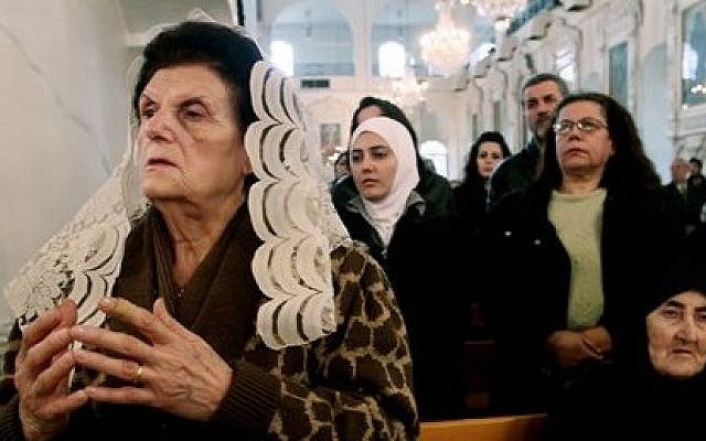 Syrian Christians and Muslims offer prayers for nuns held by rebels, at the Greek Orthodox Mariamiya Church in Damascus, Syria, on Sunday, December 8, 2013. (photo credit: AP) Syrian Christians and Muslims offer prayers for nuns held by rebels, at the Greek Orthodox Mariamiya Church in Damascus, Syria, on Sunday, December 8, 2013. (photo credit: AP)
