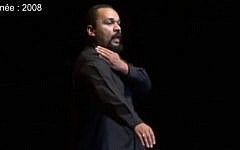 French comedian Dieudonne M'bala M'bala performing the quenelle in 2008 (photo credit: YouTube screenshot)