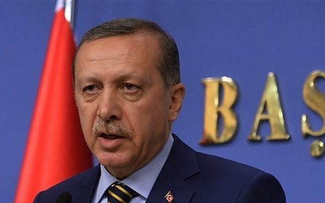 Turkey's Prime Minister Recep Tayyip Erdogan announces his new ministers in Ankara, Turkey, late Wednesday, Dec. 25, 2013 (photo credit: AP Photo) Turkey's Prime Minister Recep Tayyip Erdogan announces his new ministers in Ankara, Turkey, late Wednesday, Dec. 25, 2013 (photo credit: AP Photo)