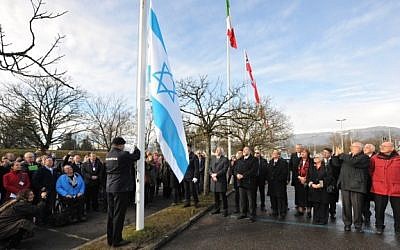 The Israeli flag is raised during a ceremony marking Israel's entrance into the European Organization for Nuclear Research, Wednesday, January 15, 2014 (photo credit: Laurent Egli)