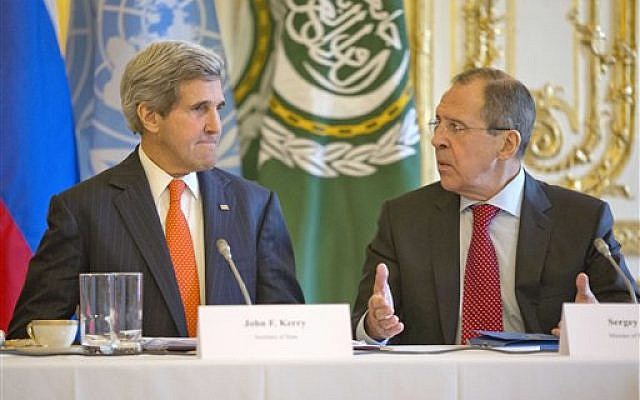 U.S. Secretary of State John Kerry, left, listens to Russia's Foreign Minister Sergey Lavrov before the start of their joint meeting with U.N.-Arab League envoy for Syria Lakhdar Brahimi at the U.S. ambassador's residence in Paris, France, Monday, January 13, 2014. (photo credit: AP/Pablo Martinez Monsivais, Pool) U.S. Secretary of State John Kerry, left, listens to Russia's Foreign Minister Sergey Lavrov before the start of their joint meeting with U.N.-Arab League envoy for Syria Lakhdar Brahimi at the U.S. ambassador's residence in Paris, France, Monday, January 13, 2014. (photo credit: AP/Pablo Martinez Monsivais, Pool)